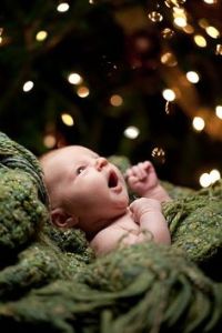 baby with mouth open and tree